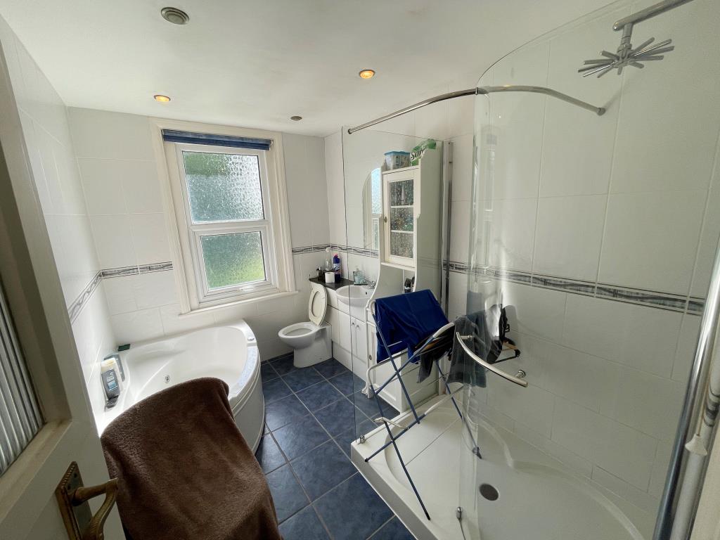 Lot: 38 - TWO-BEDROOM DETACHED BUNGALOW FOR IMPROVEMENT - Bathroom with shower and W.C.
